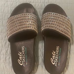 Cali from Skechers, women’s size 7. Nearly brand new, worn 1x.